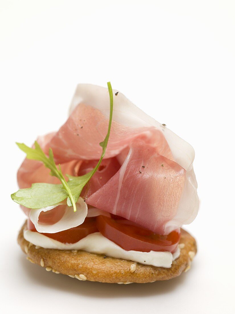 Prosciutto and rocket on cracker