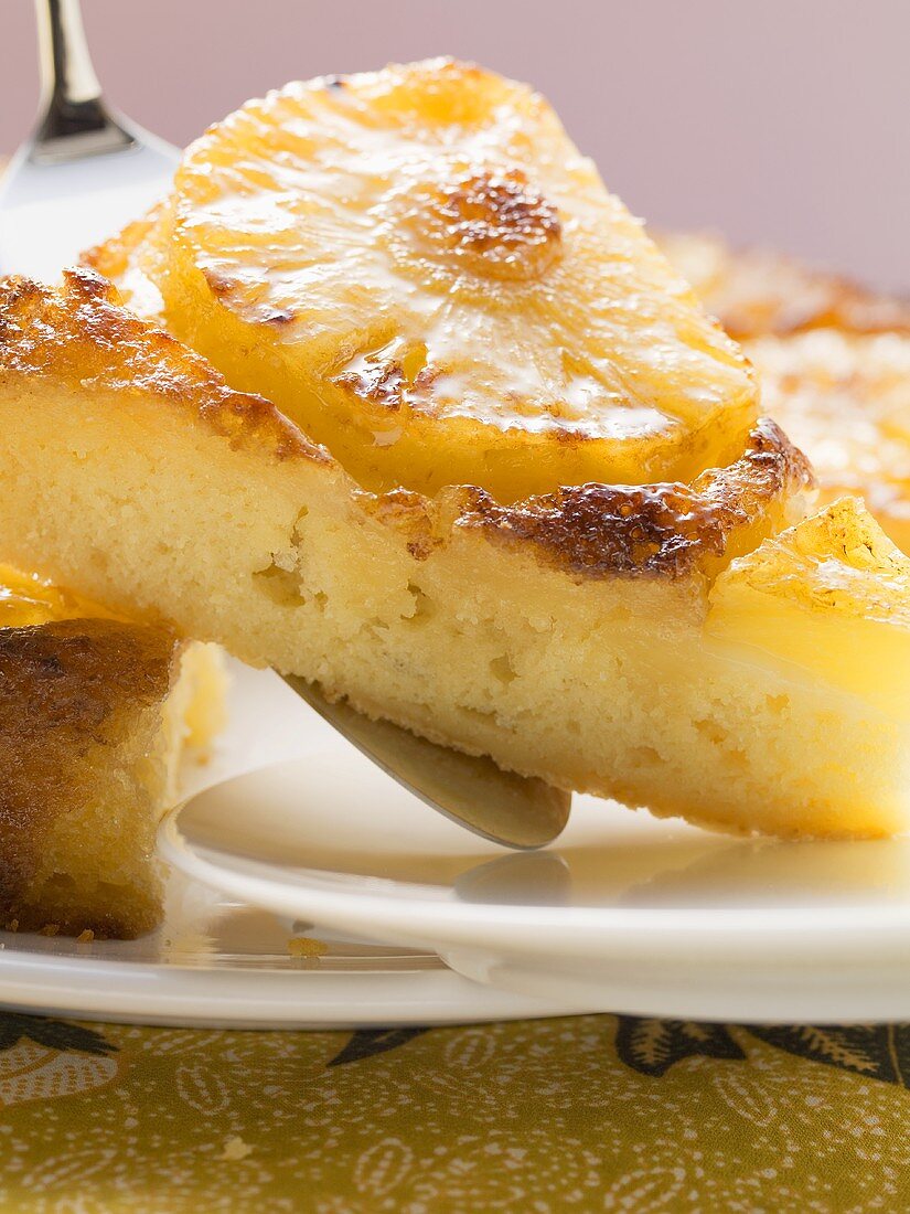 Pineapple upside-down cake, a piece cut