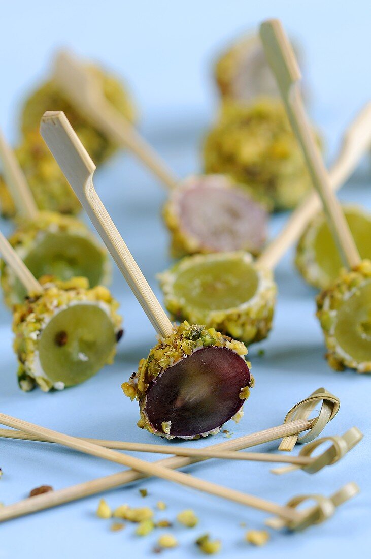 Grapes coated in goat's cheese & pistachios on cocktail sticks