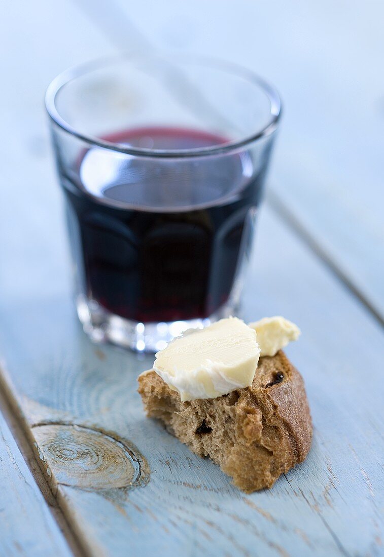 Bread and cheese and glass of red wine