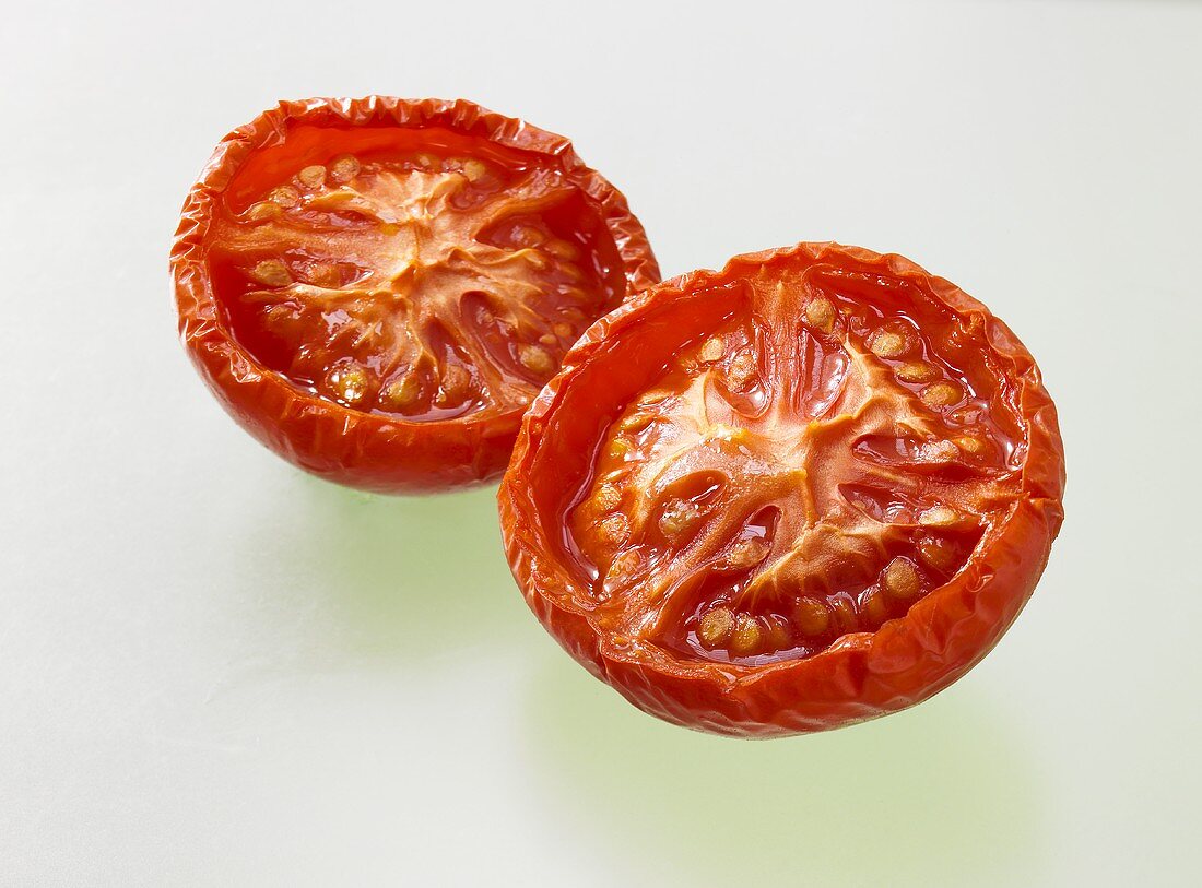 Two dried tomato halves