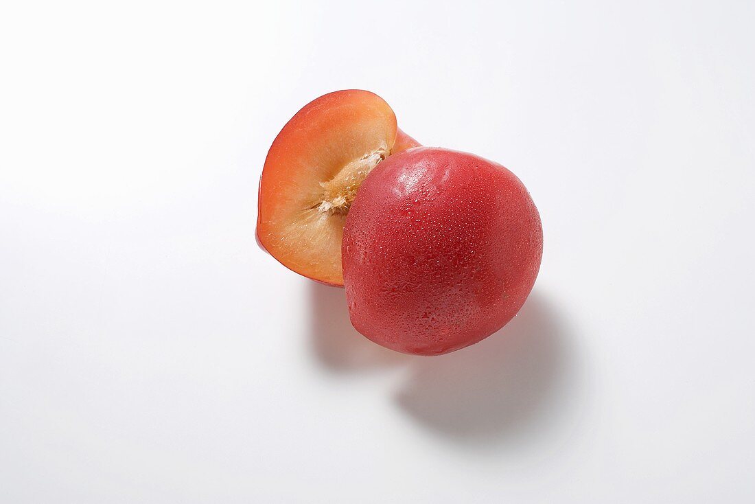 Halved red plum
