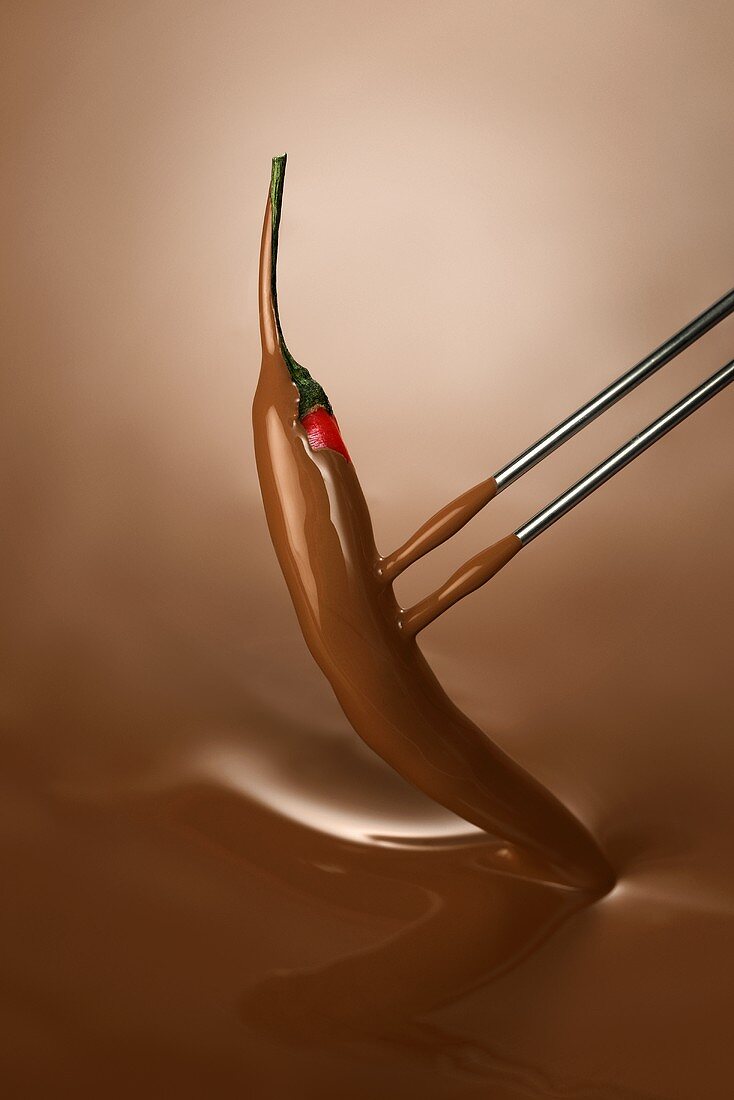 Dipping a chilli in chocolate fondue