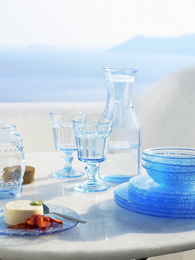 Laid table with a view of the sea (Greece)