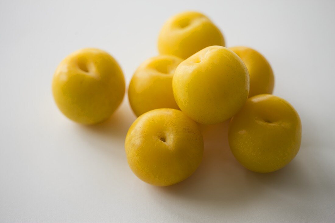 Several yellow plums