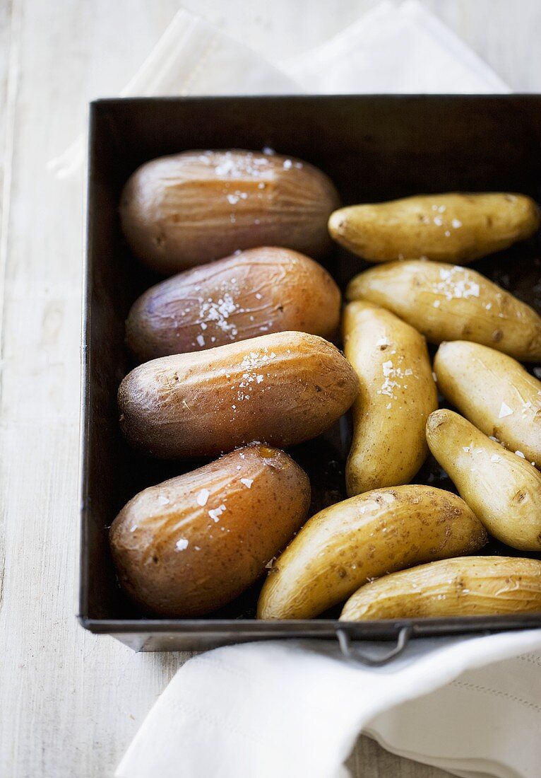 Salted potatoes in a roasting tin