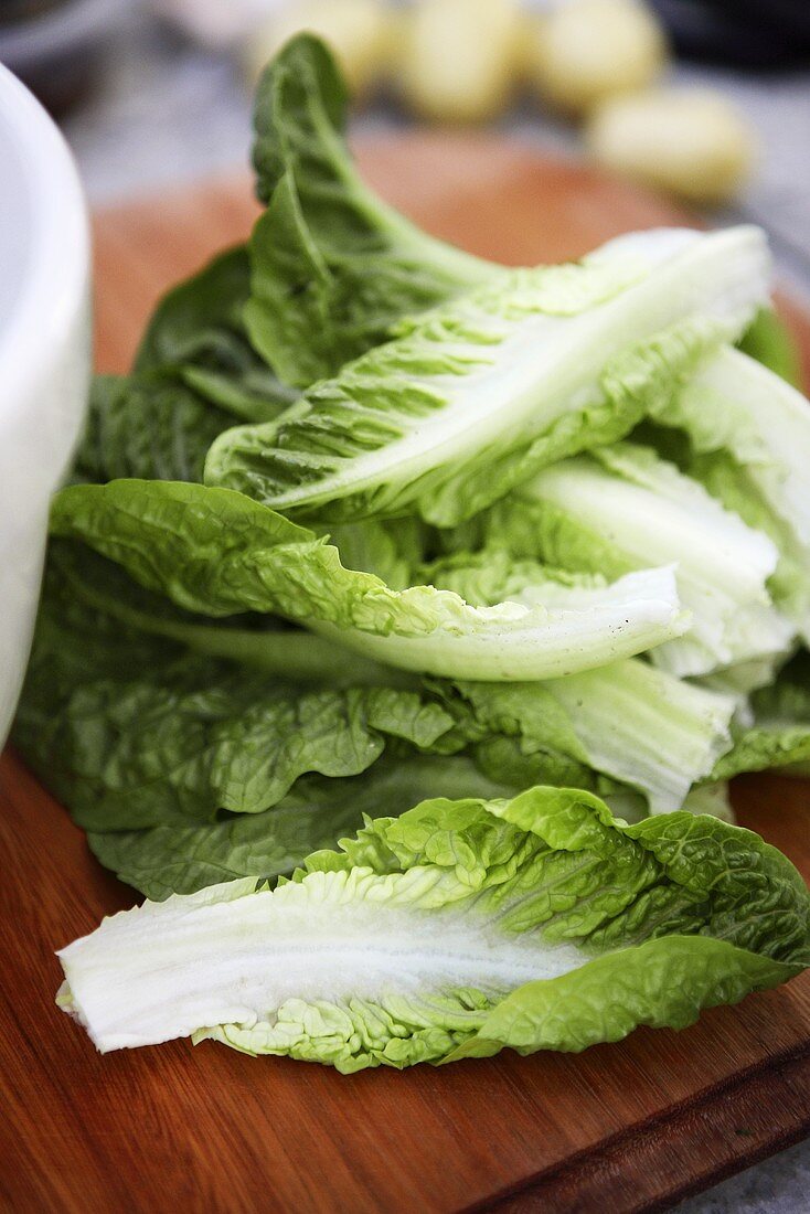 Romaine lettuce on wooden board