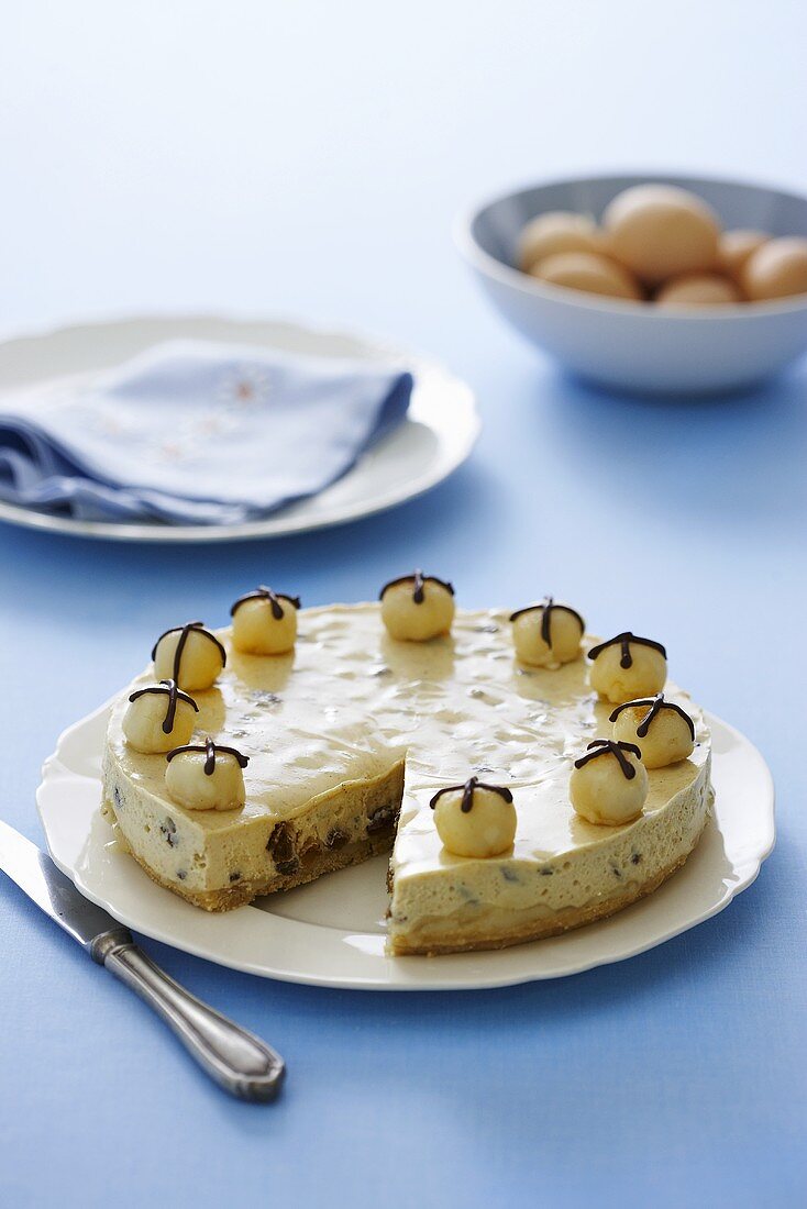 Cheesecake with dried fruit and marzipan balls