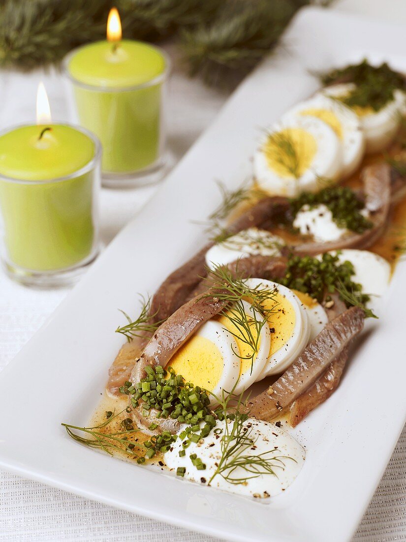 Anchovies & herrings with egg & sour cream (Scandinavia)