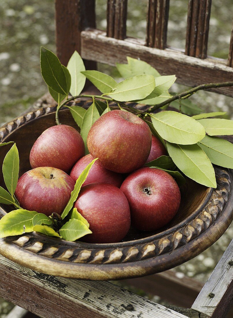 Fresh apples in a wooden bowl