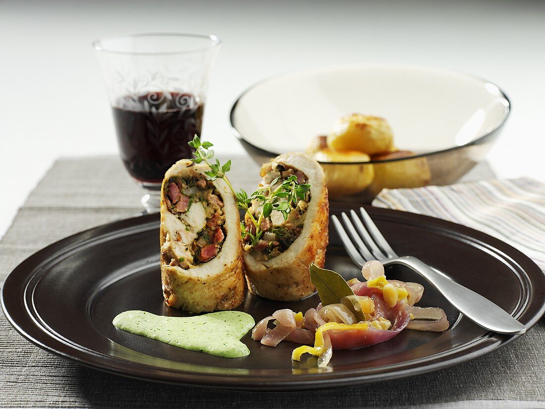 Chicken roulade with ham and herb filling, roast potatoes