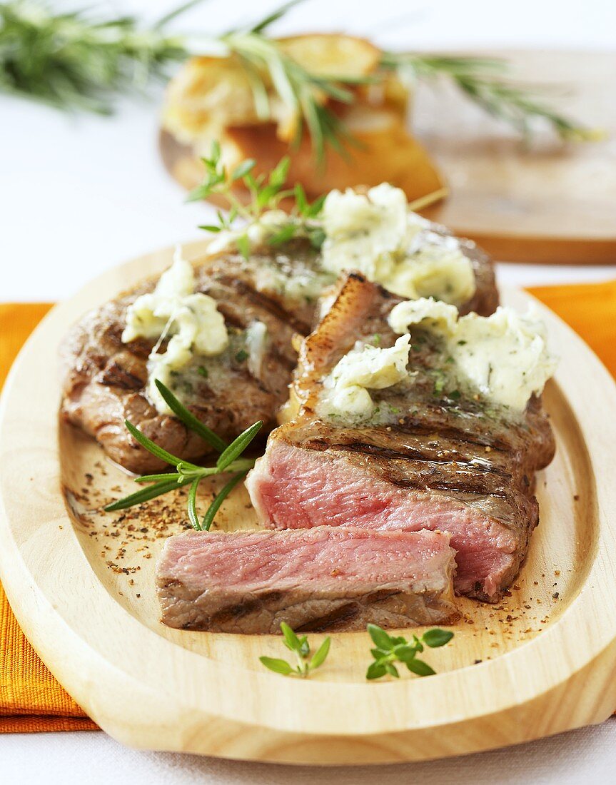 Grilled rump steak with garlic and herb butter