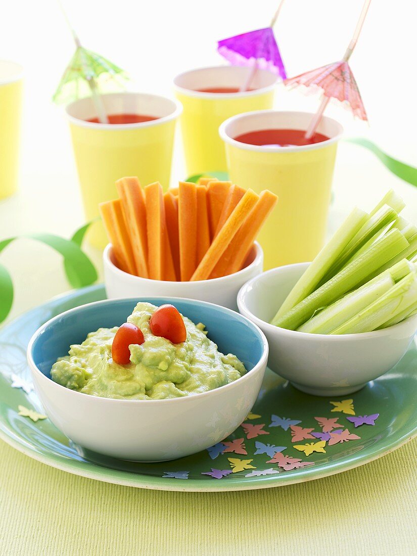 Vegetable sticks and avocado dip for children