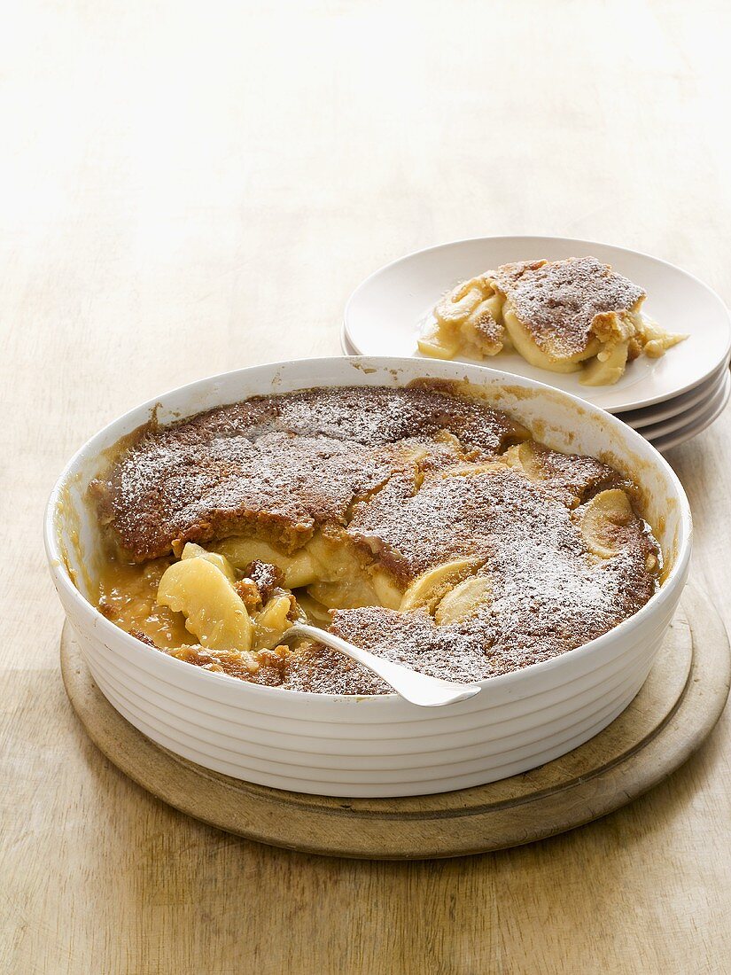 Apple pudding sprinkled with icing sugar