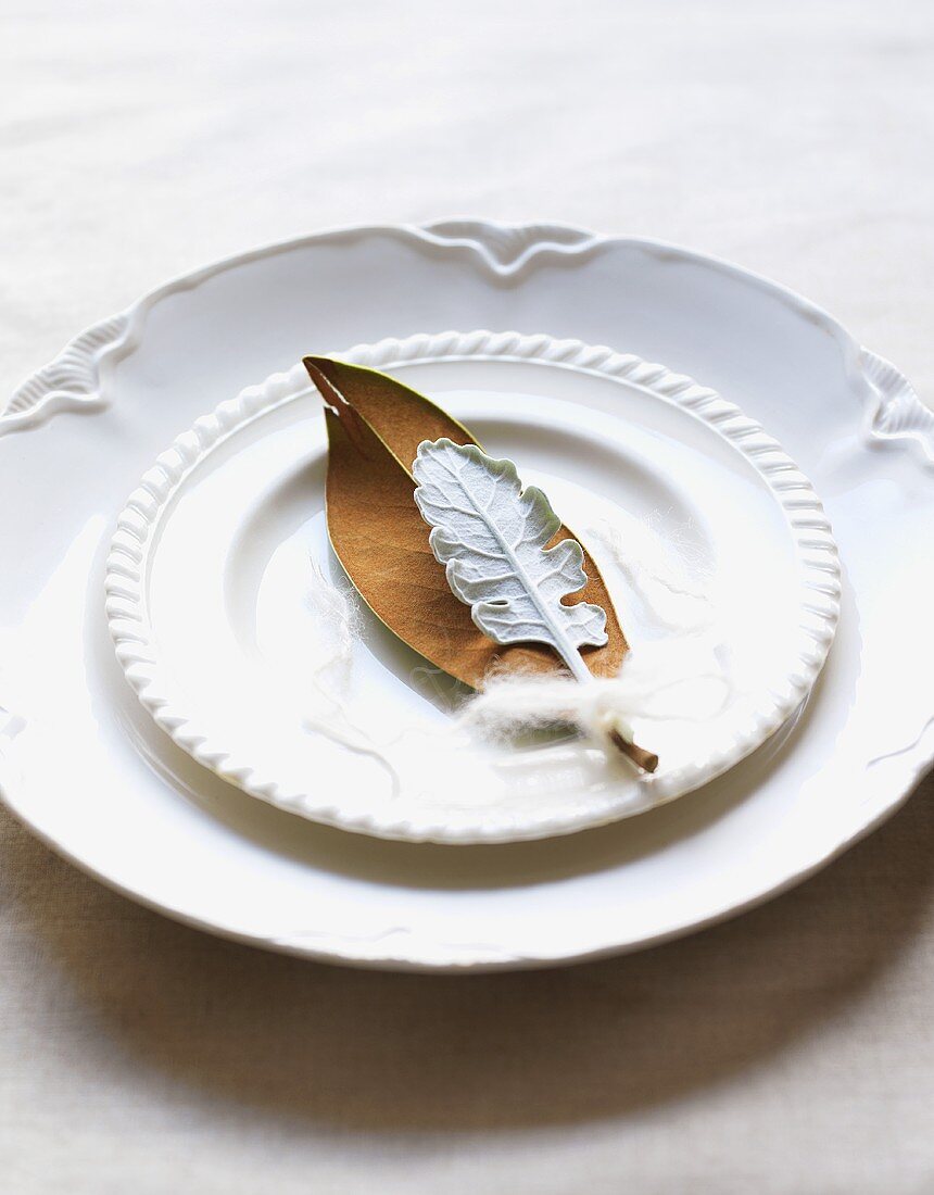 White place-setting with leaves