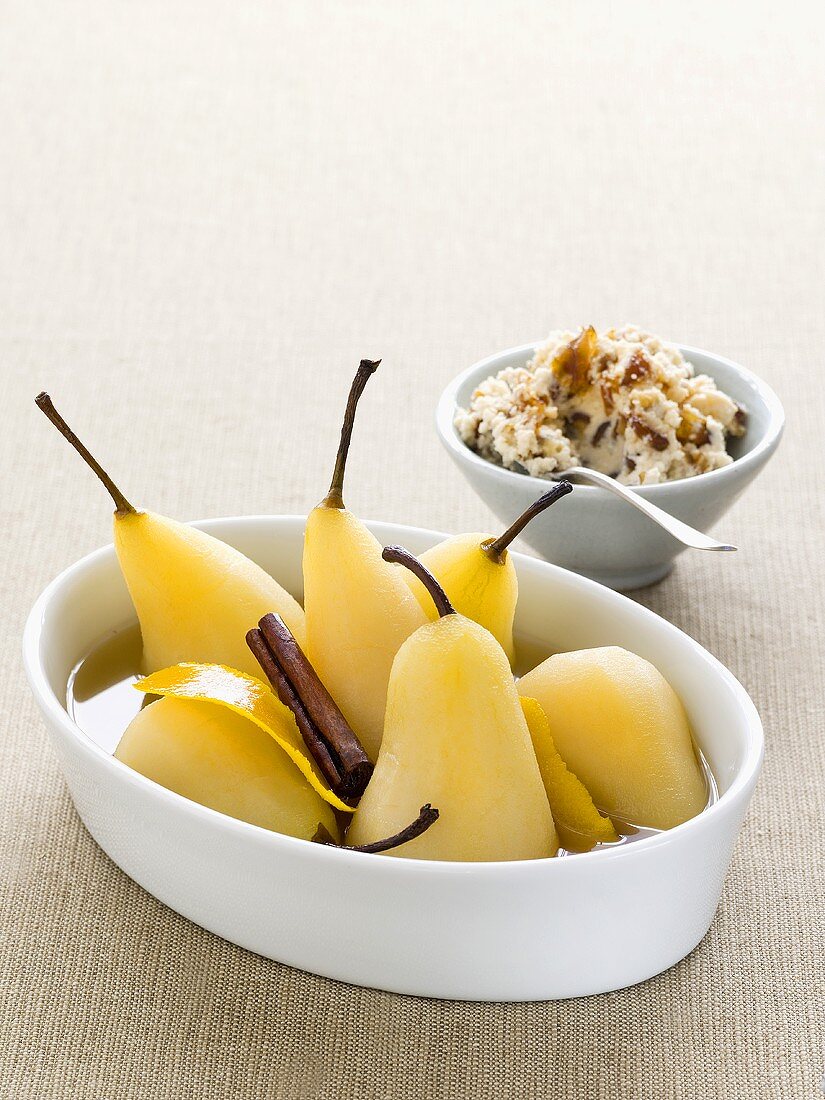Poached pears in orange sauce
