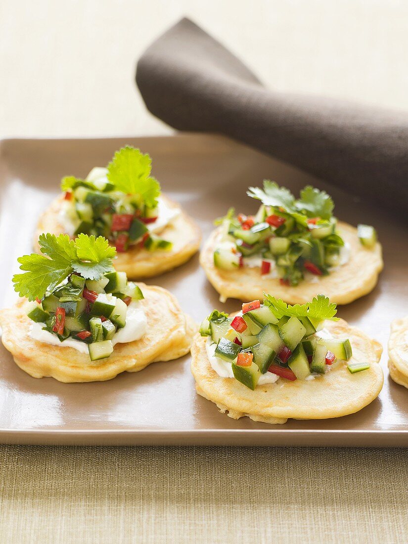 Potato pikelets with cucumber salsa