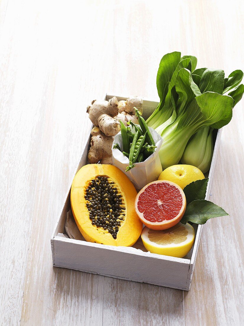 Box of fresh exotic fruit and vegetables