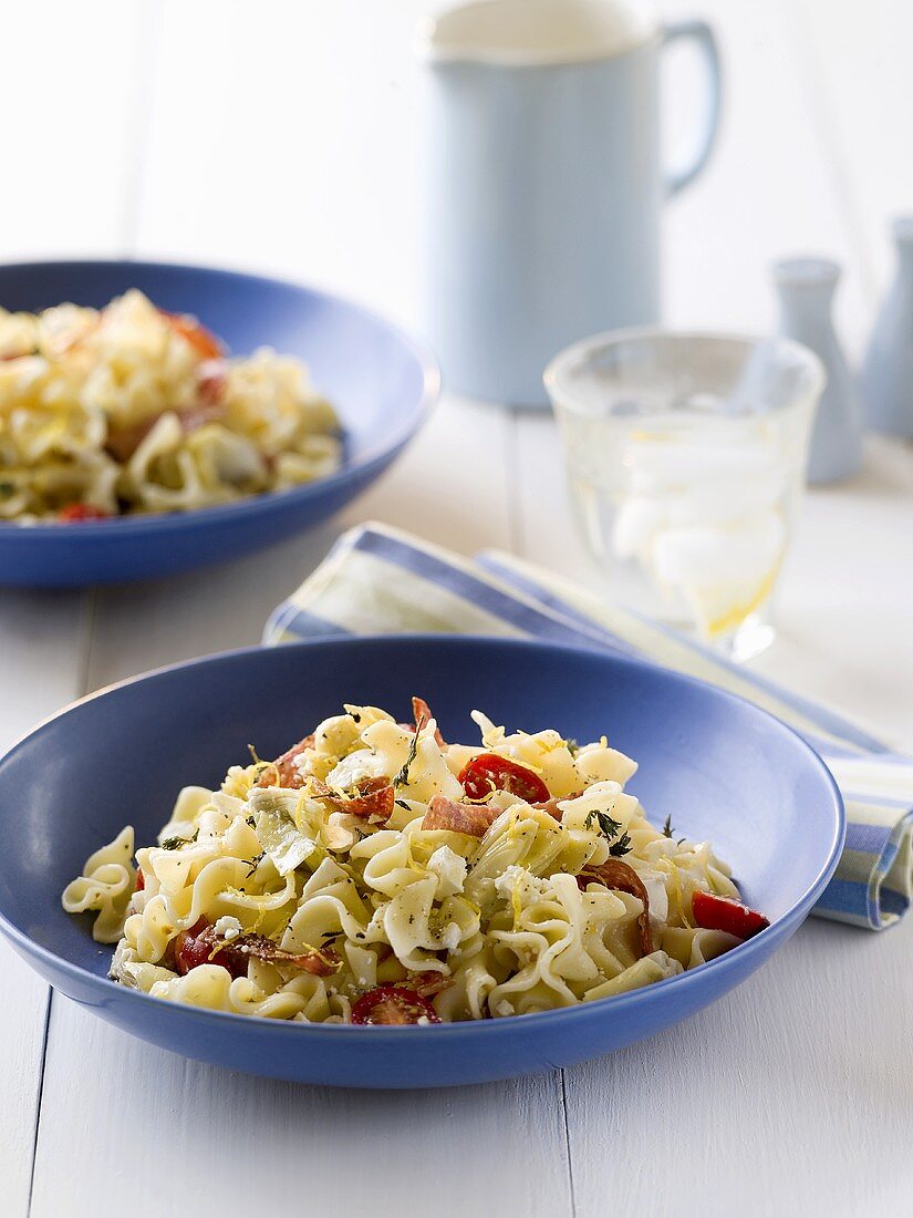 Pasta with artichokes and salami