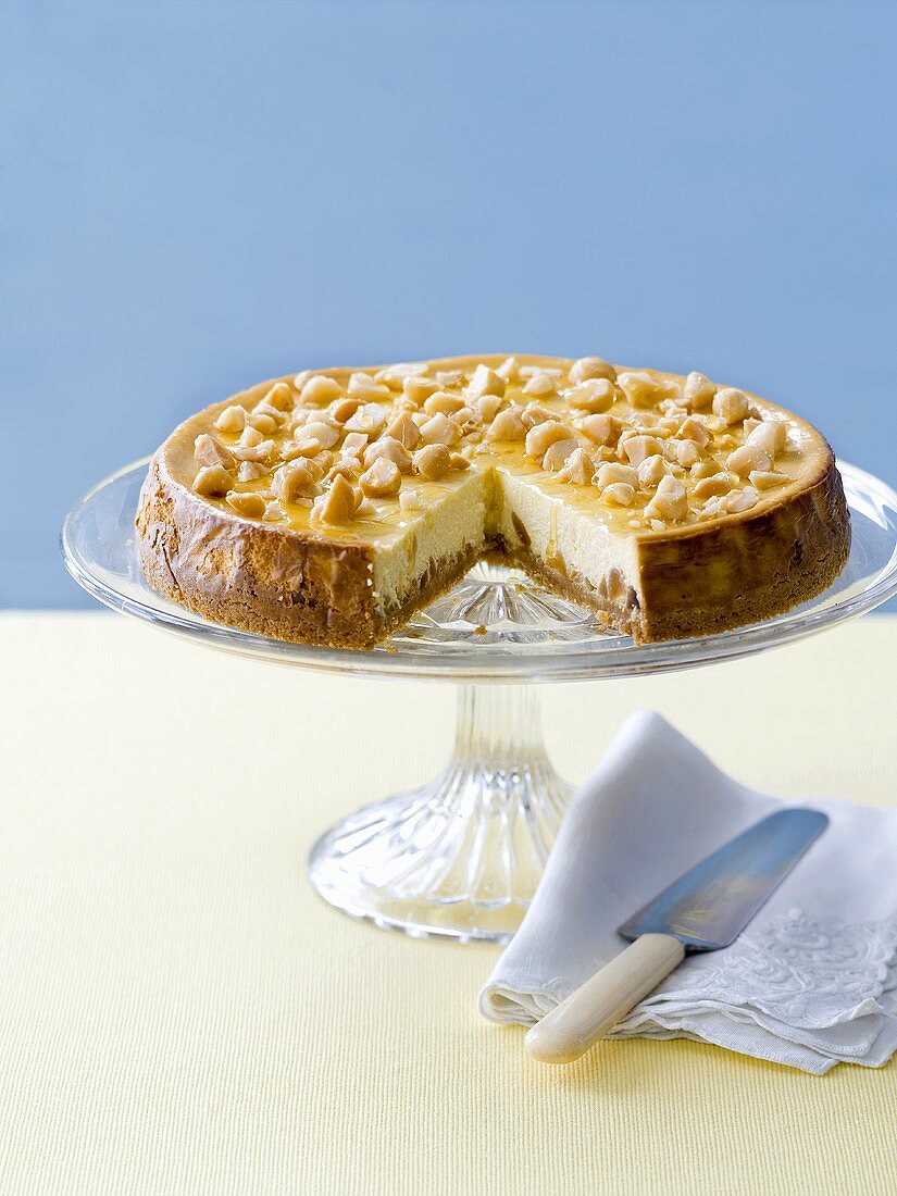 Cheesecake with macadamia nuts, a piece removed