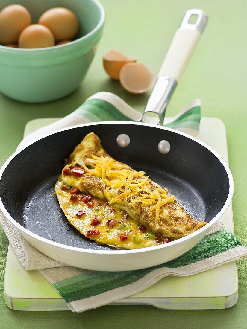 Cheese omelette in frying pan