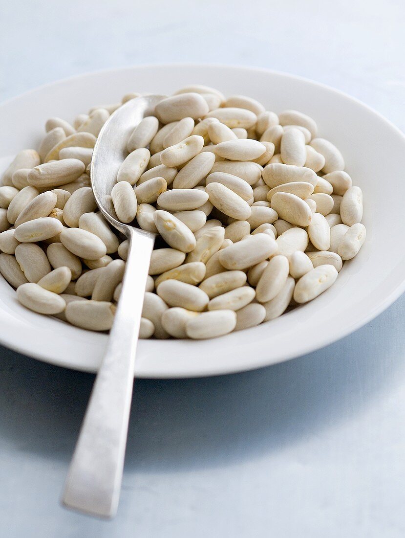 White beans on a plate with spoon