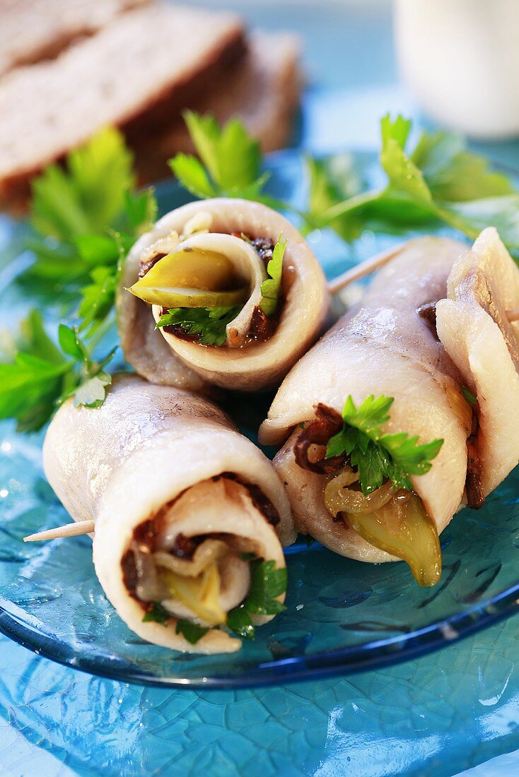 Filled herring rolls secured with toothpicks