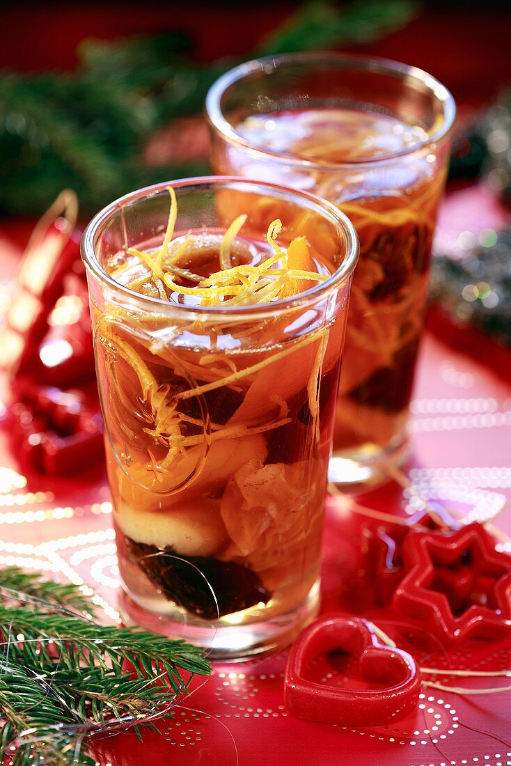 Fruit compote with lemon zest in small glasses (Christmas)