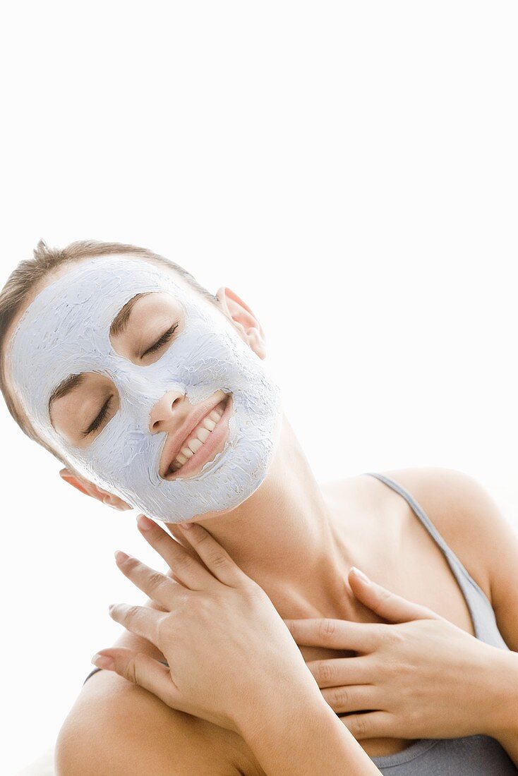 Young woman with blue facial mask