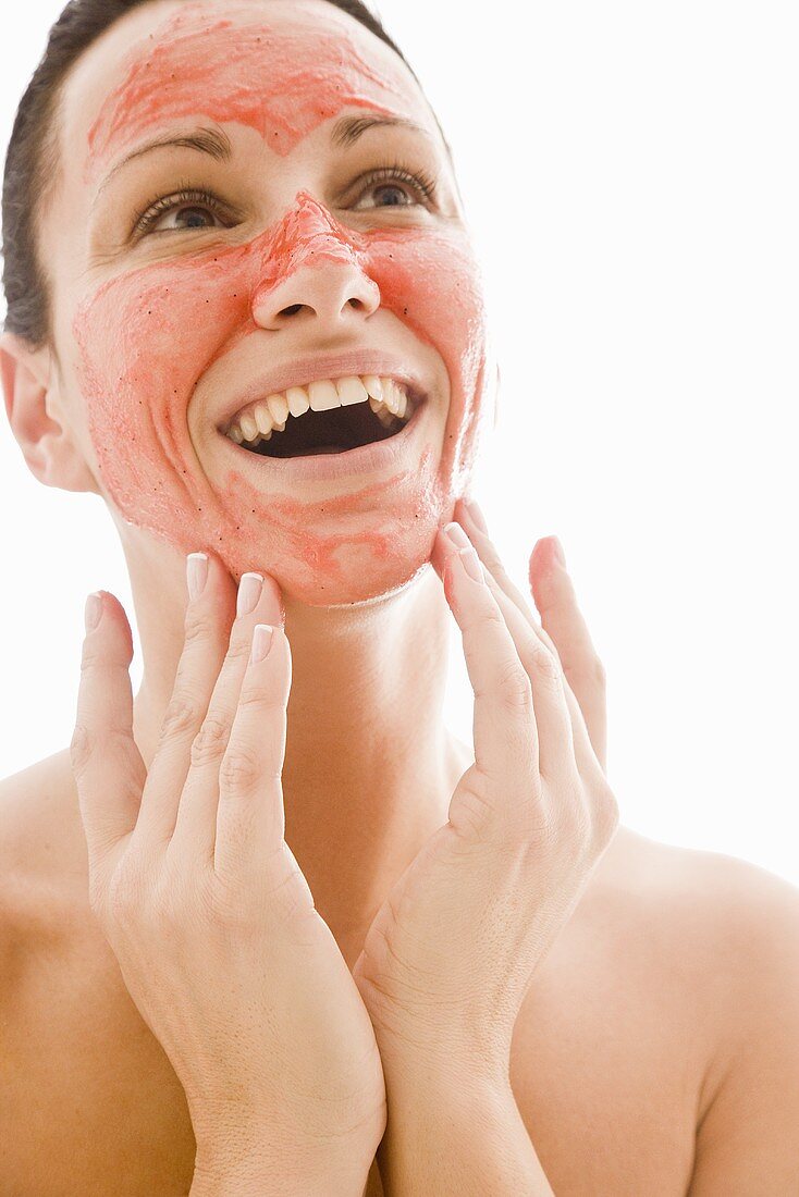 Woman with red facial mask