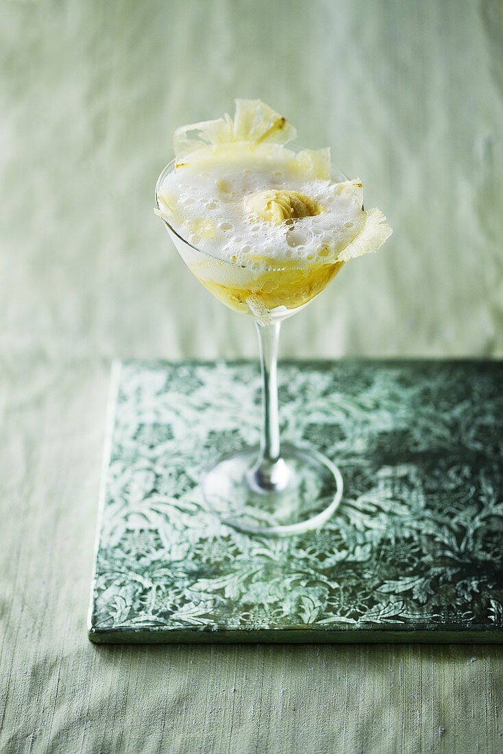 Sparkling wine cocktail with lemon sorbet and pineapple