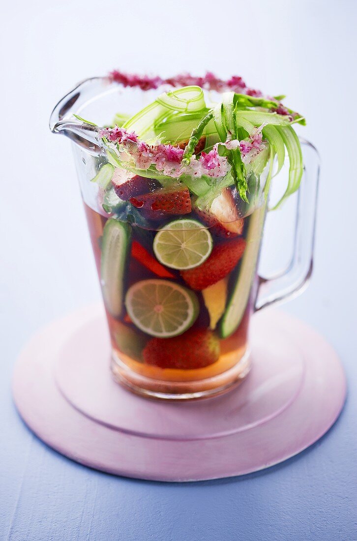 Strawberry and lime punch in glass jug