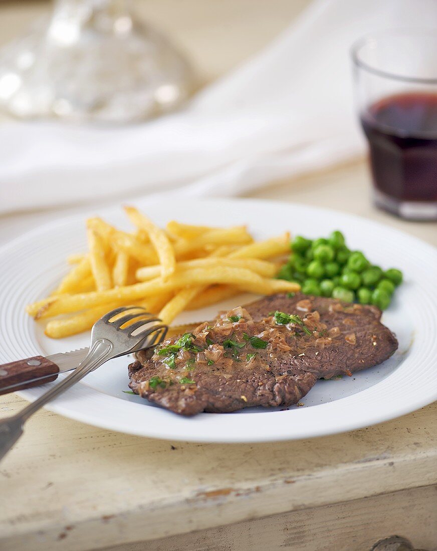 Beefsteak with chips and peas