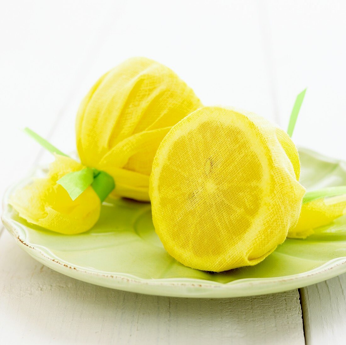 Two lemon halves wrapped in muslin