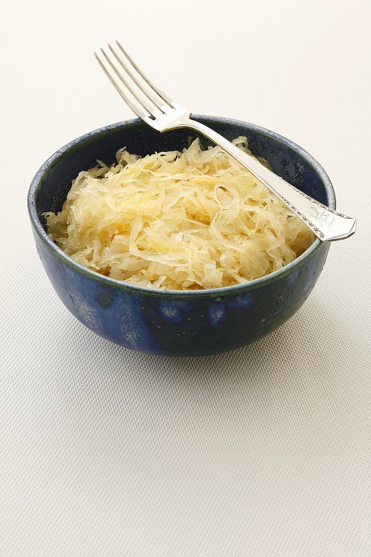 A bowl of sauerkraut with fork