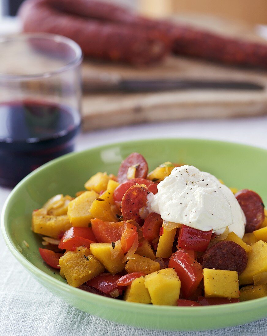 Pumpkin stew with sausage and crème fraîche