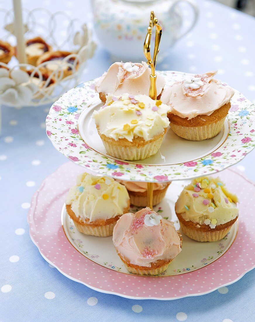 Fairy cakes on tiered stand for afternoon tea