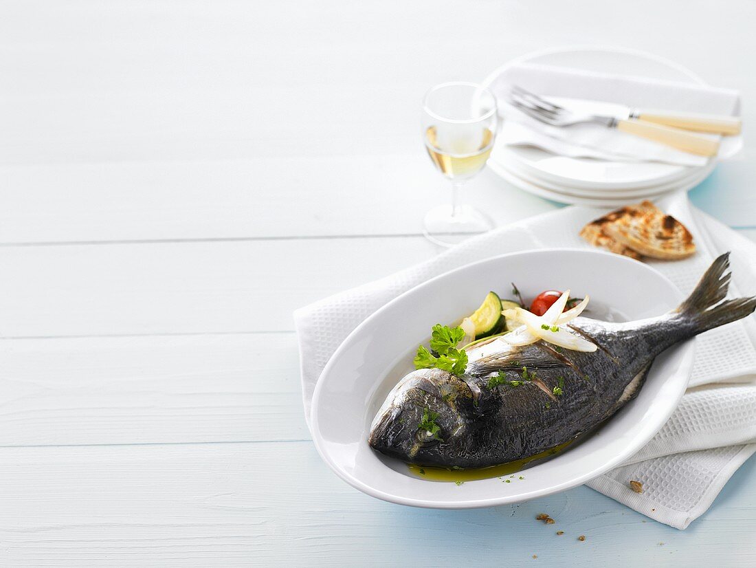Sea bream with olive oil and vegetables