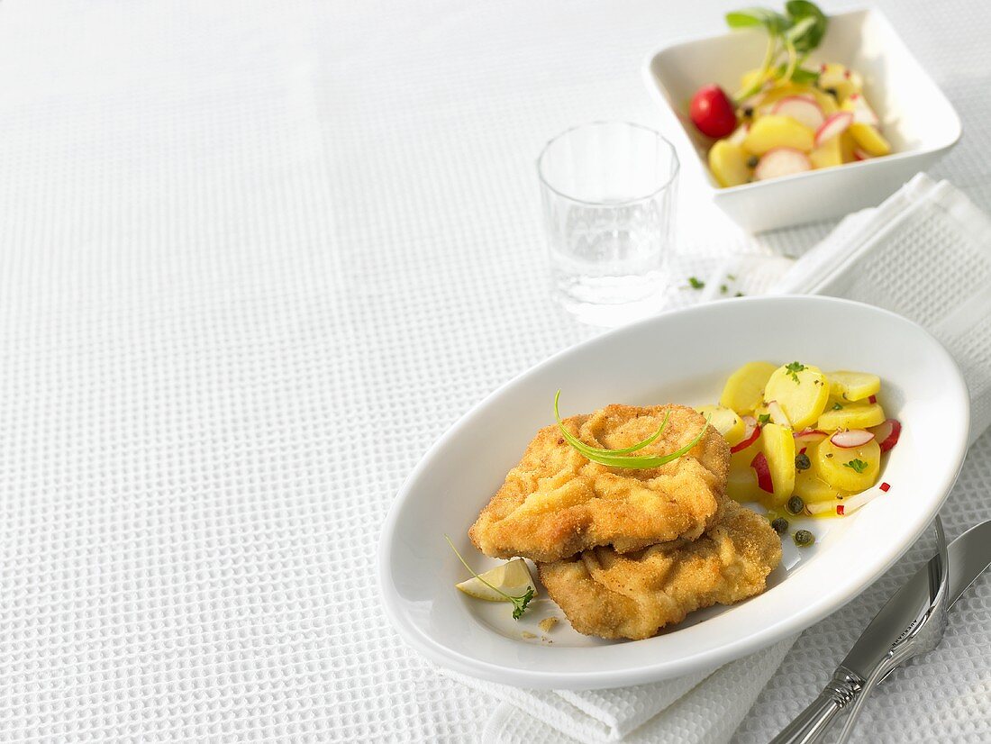 Wiener schnitzel (veal escalope) with potato & radish salad