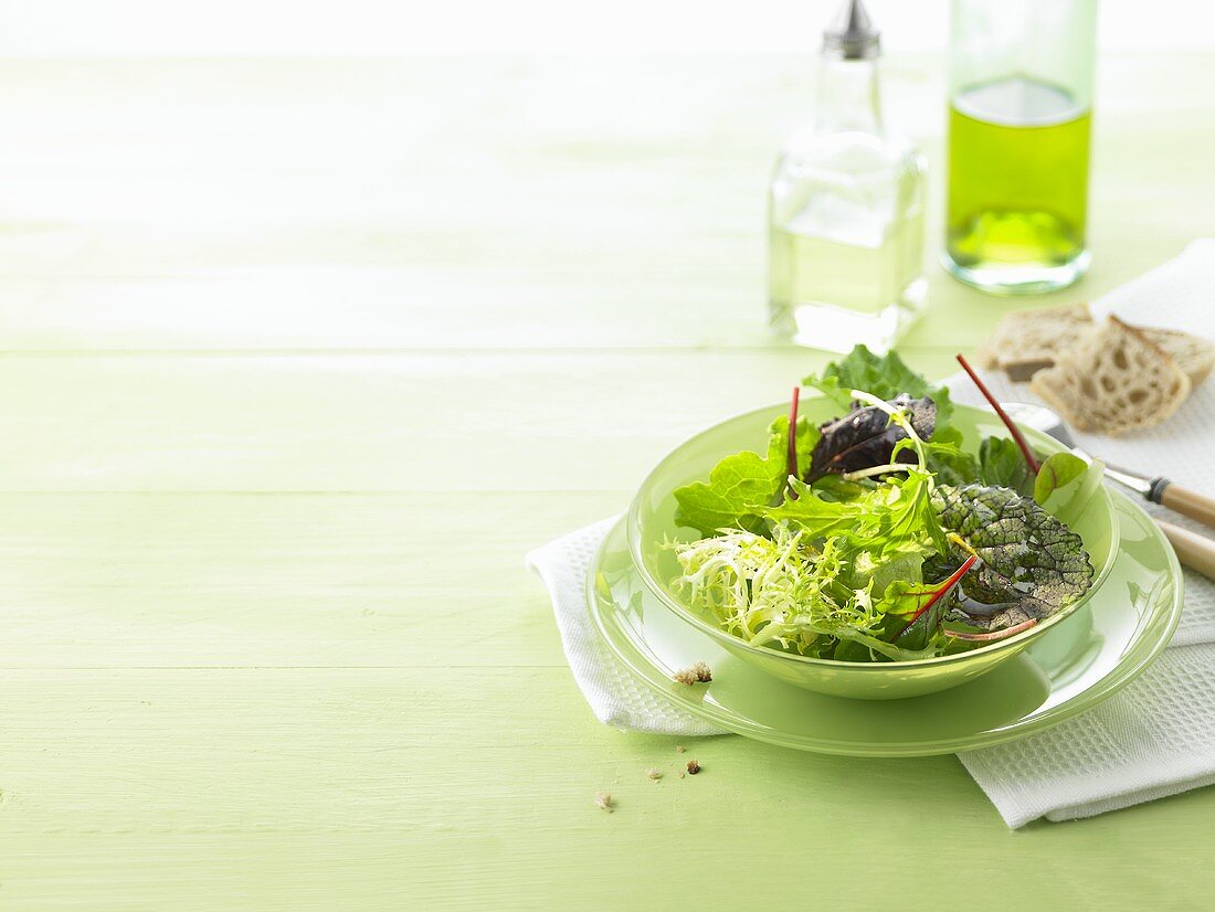 Salad leaves with light dressing and ciabatta