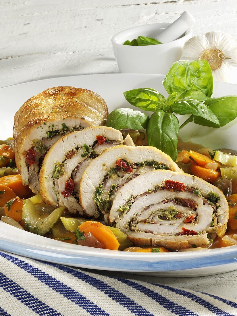 Mediterranean roast turkey roll on vegetables