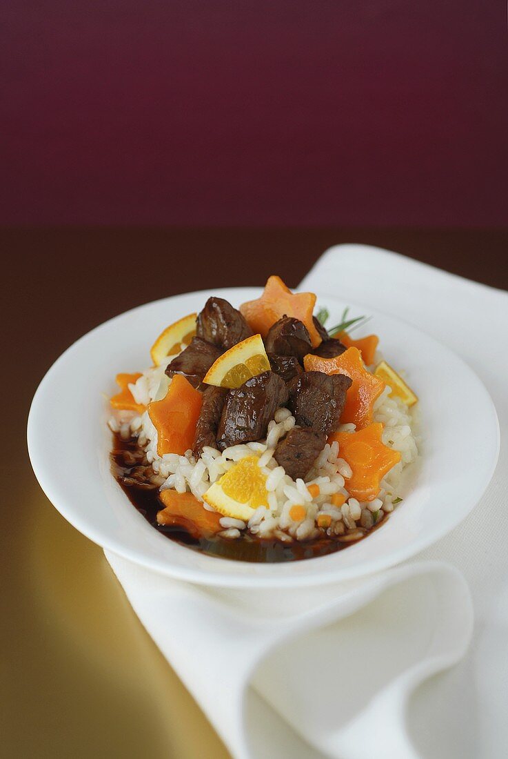 Venison risotto with carrot stars and oranges