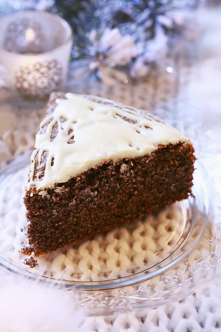 A piece of iced poppy seed cake (Christmas)