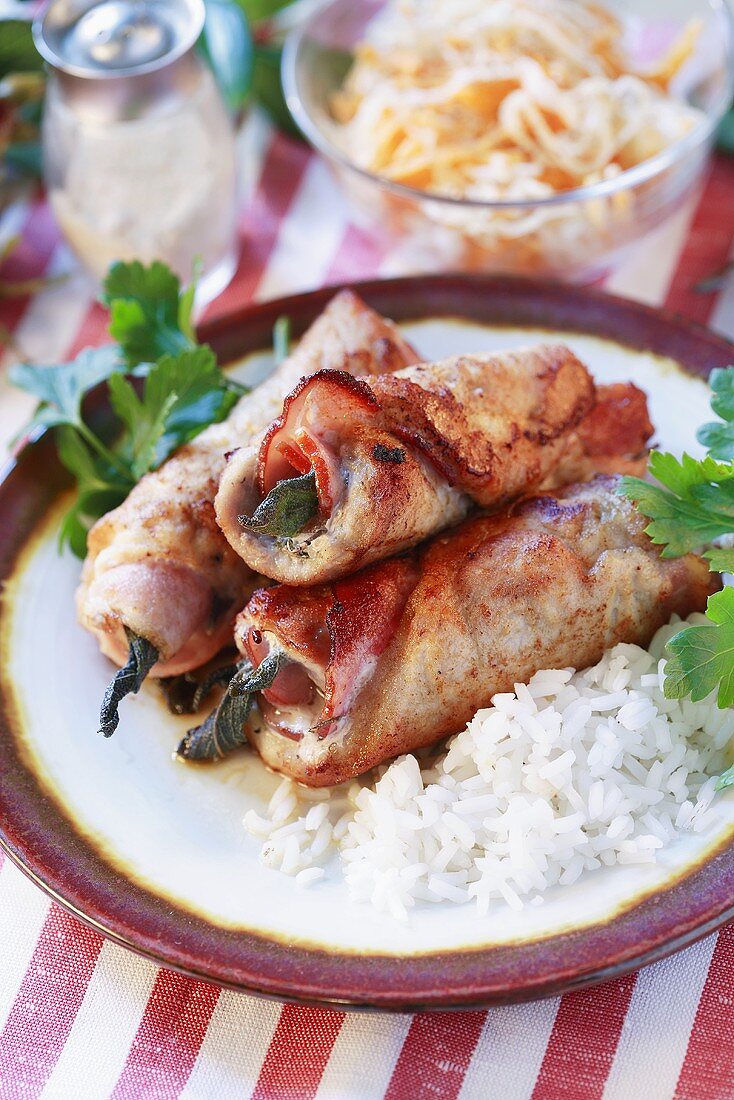 Pork roulades with ham, served with rice