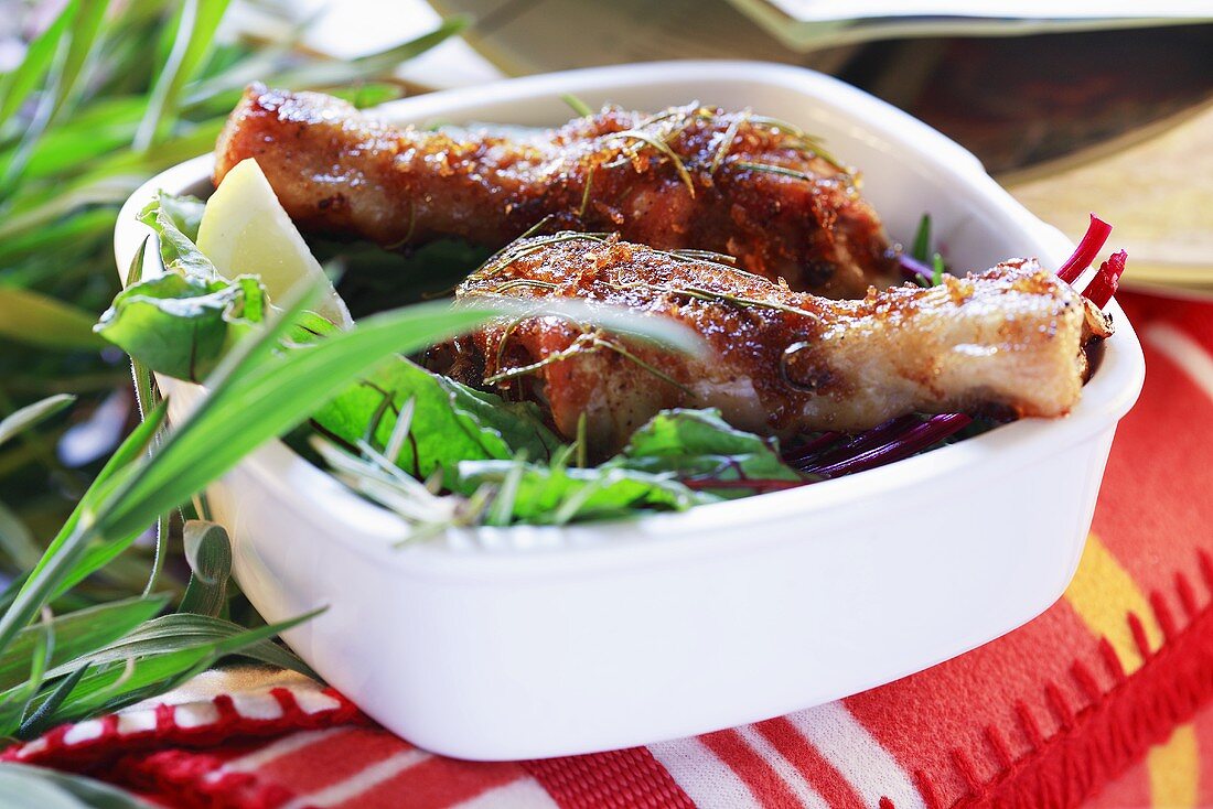 Crispy chicken legs with salad