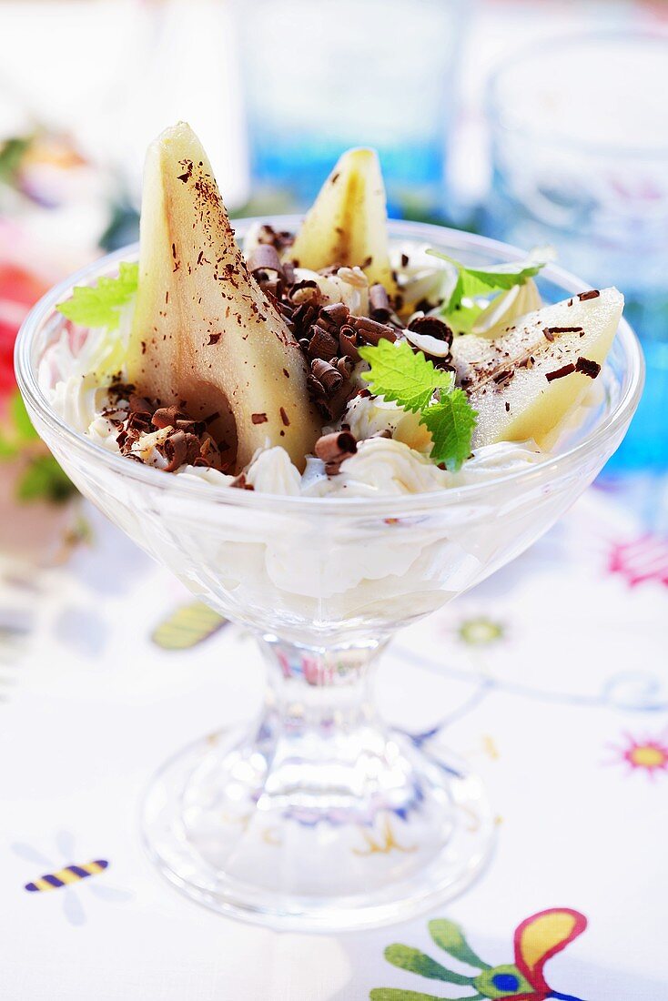 Pears in rum cream with chocolate curls