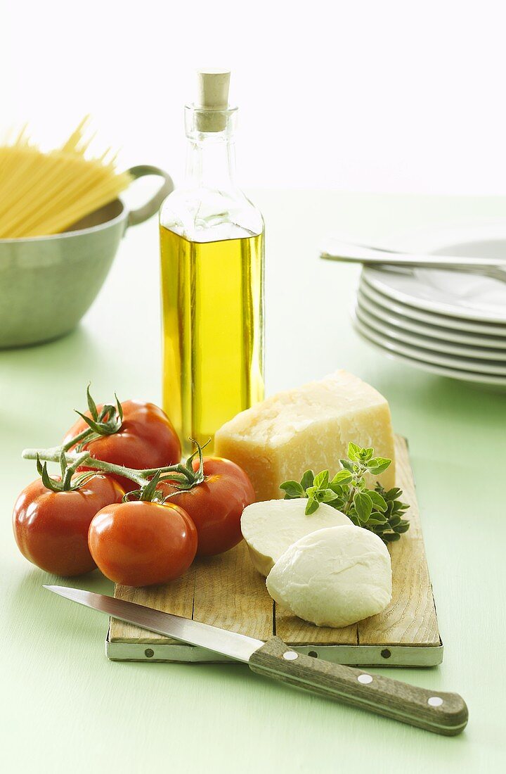 Tomatoes, mozzarella, Parmesan, olive oil and spaghetti