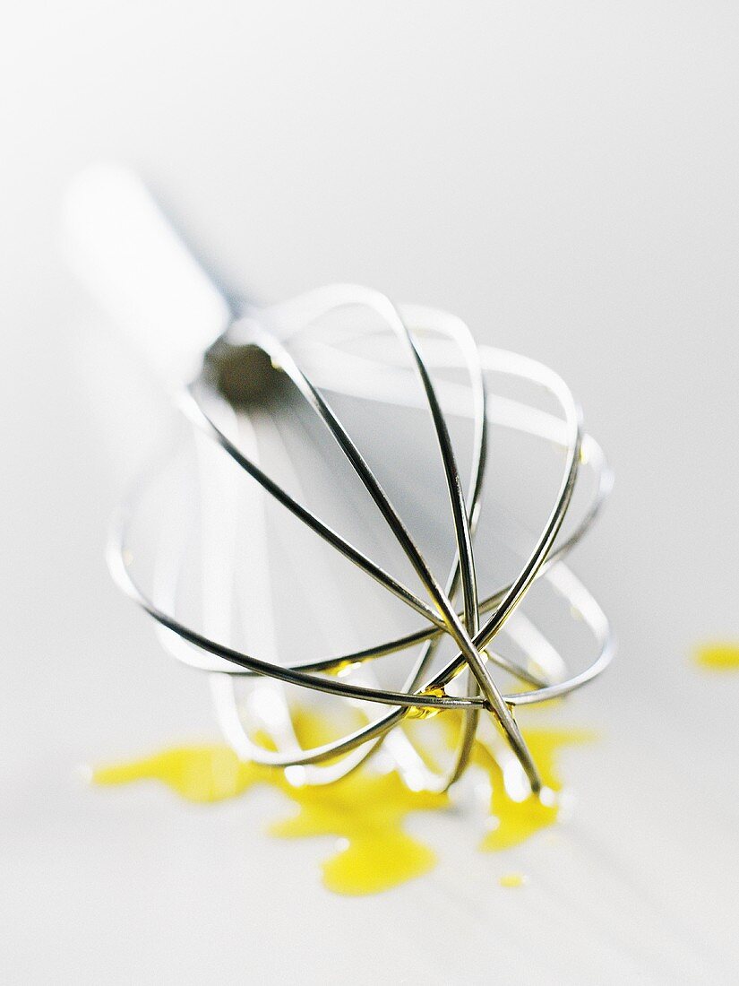 Olive oil and whisk