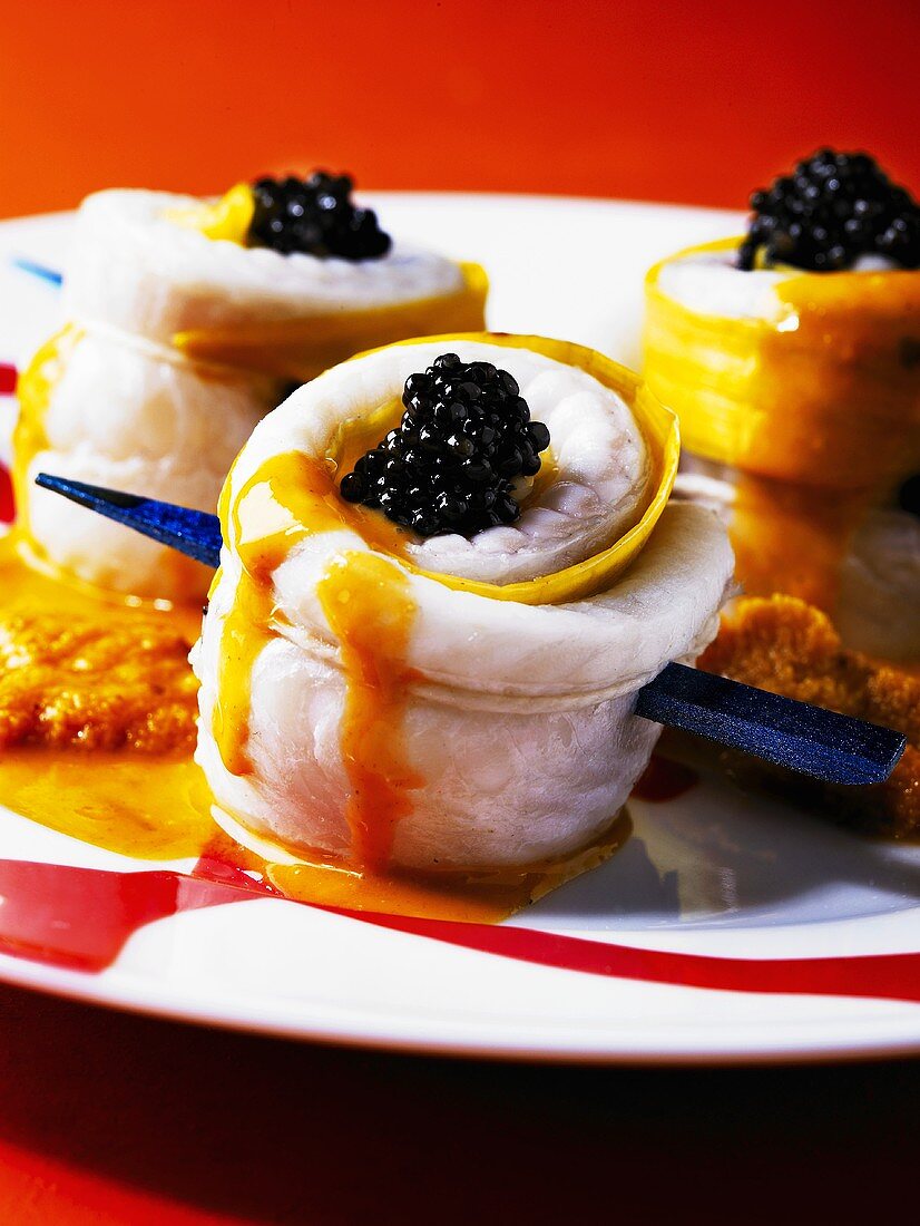 Sole rolls with lobster sauce and caviar