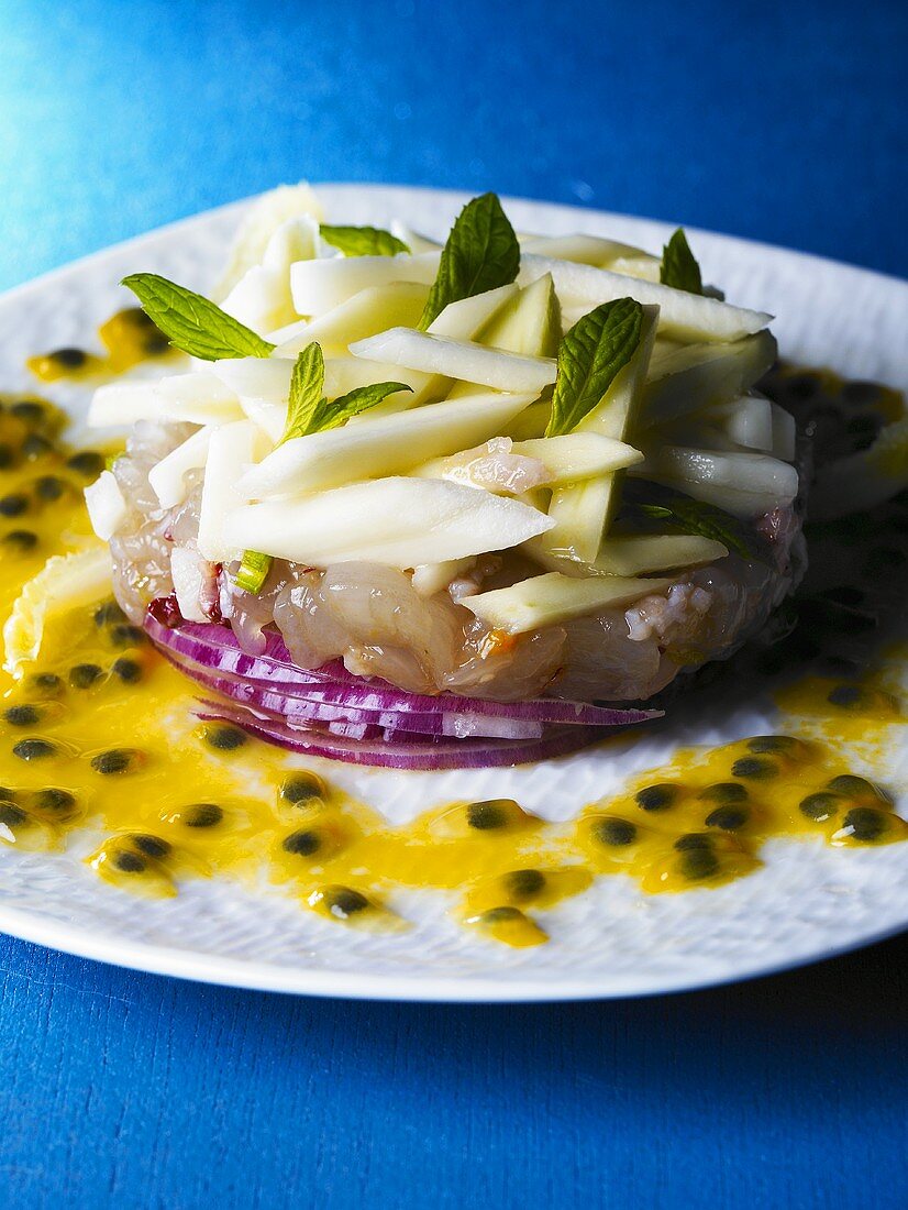 Langouste tartare on red onions with passion fruit